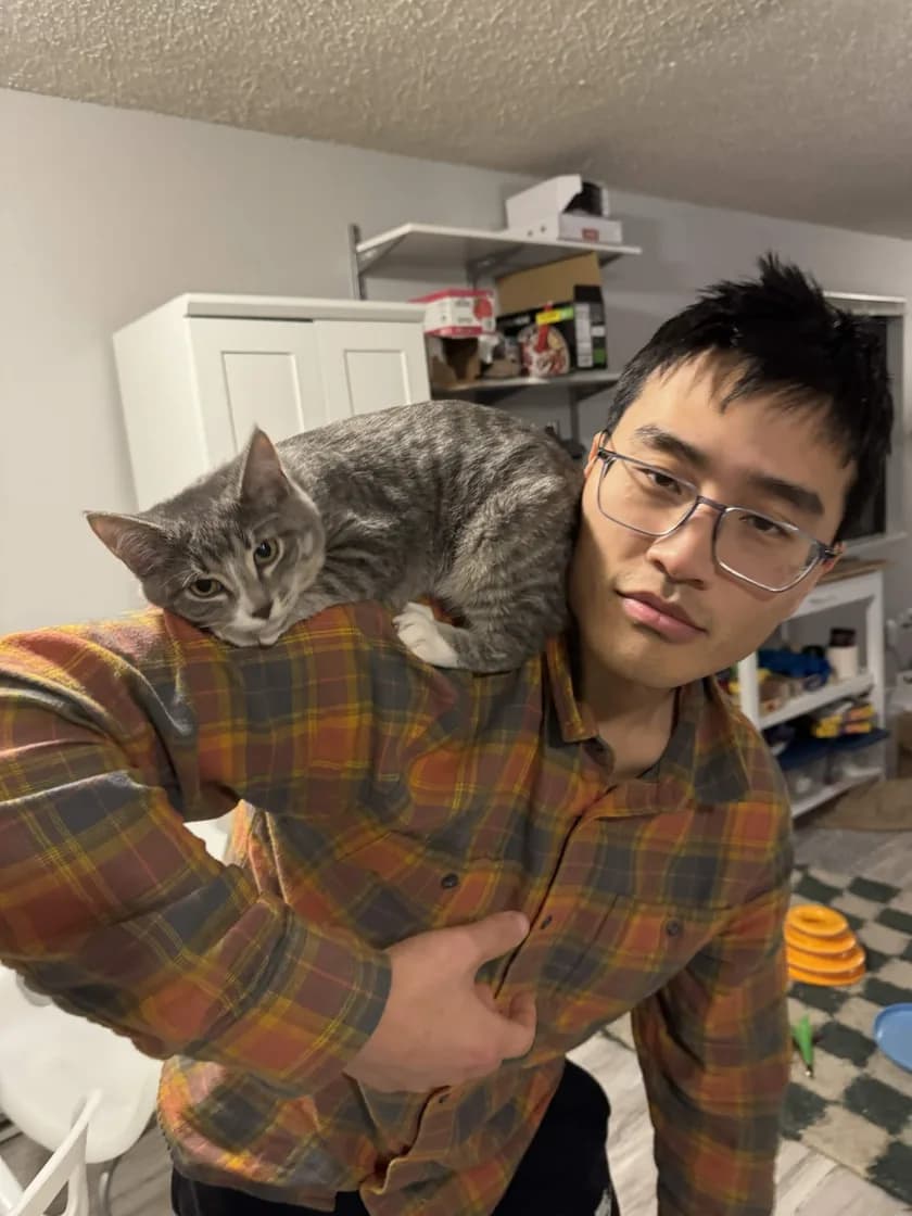Steven, a PDX Cat Dad with his cat